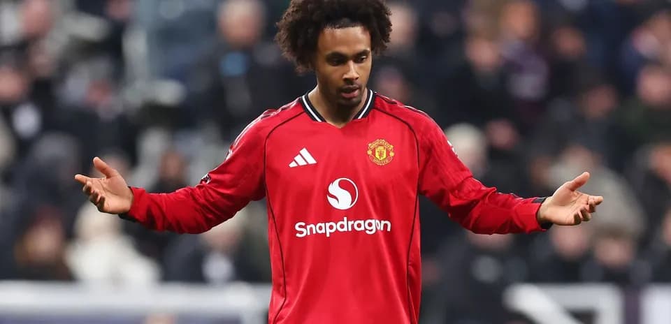 Player in red Manchester United kit on pitch