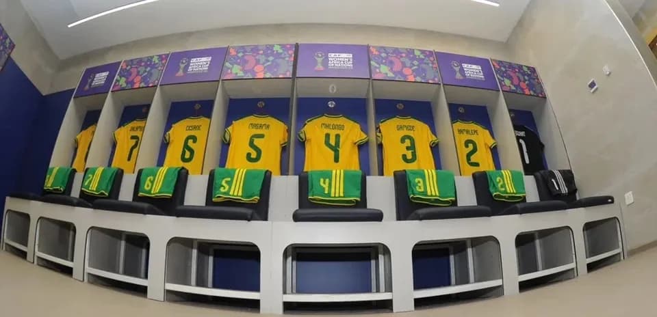 Team jerseys hanging in locker room before match