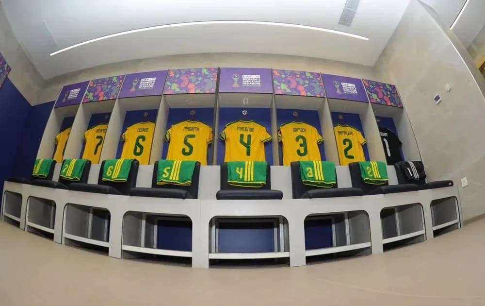 Team jerseys hanging in locker room before match