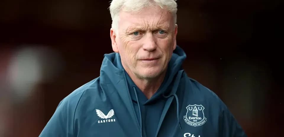Manager in Everton jacket before a match