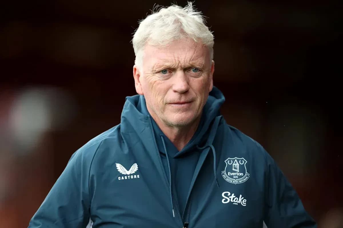 Manager in Everton jacket before a match