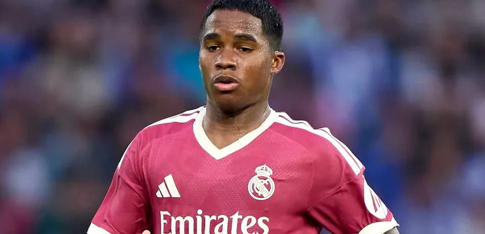 Player in pink Real Madrid jersey during match