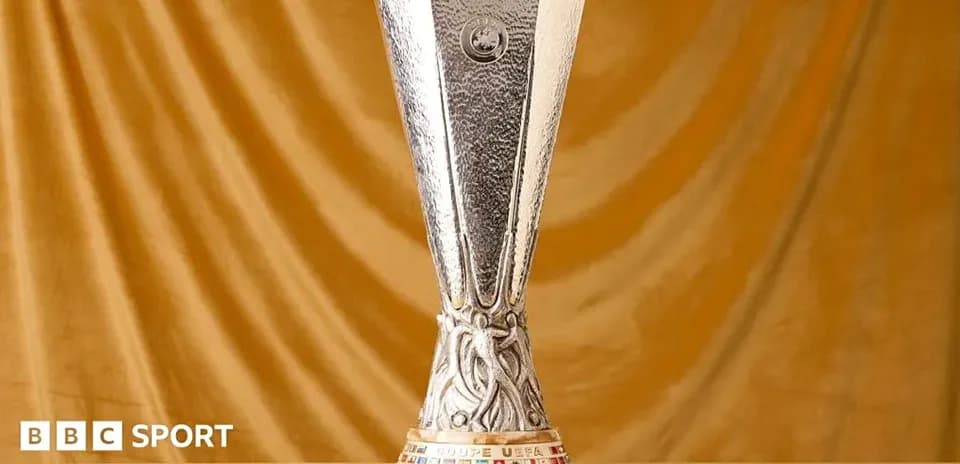 UEFA Europa League trophy on a golden background