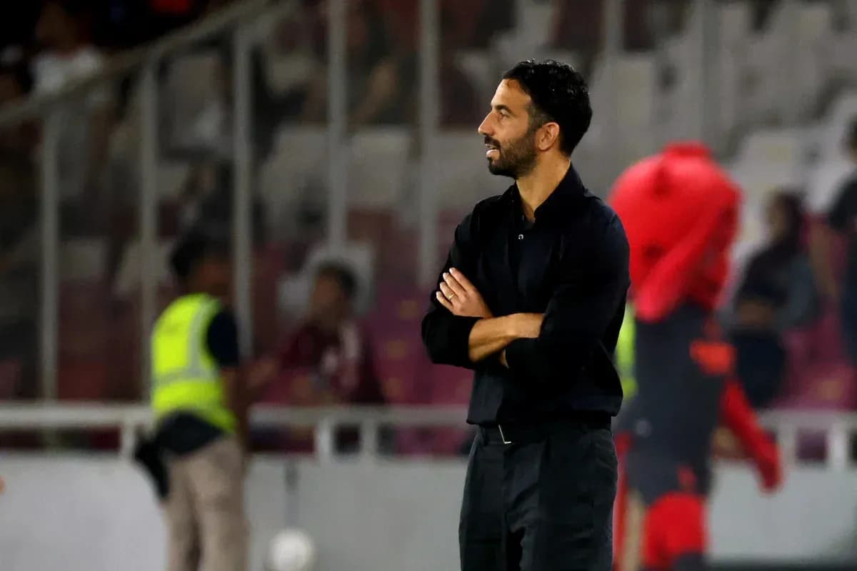 Coach observing match from the sidelines