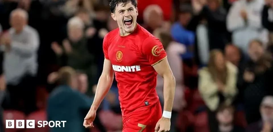 Player celebrating a goal in red jersey