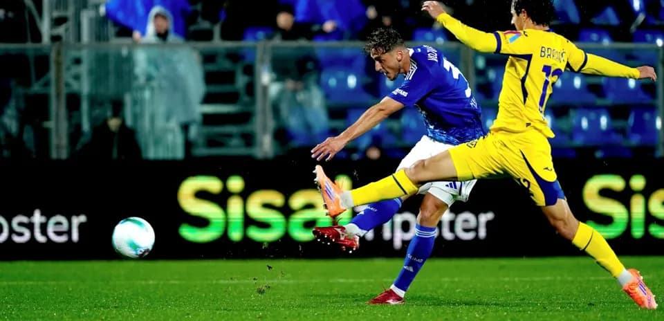 Hellas Verona player striking the ball in match