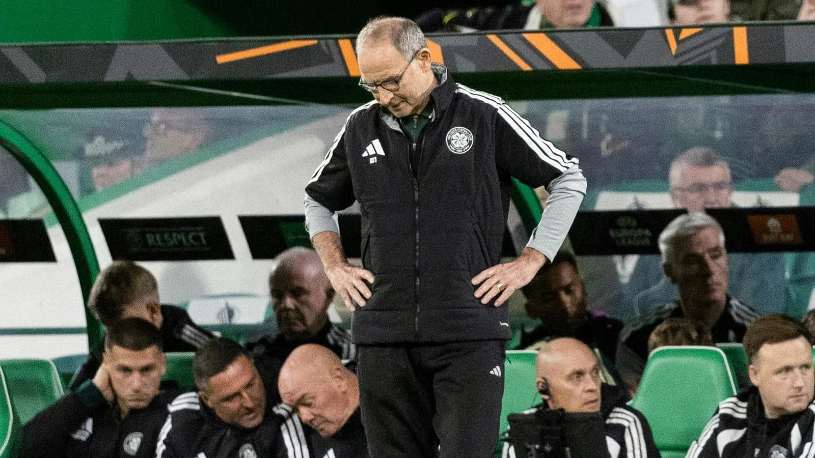 Coach looking down on the bench during match