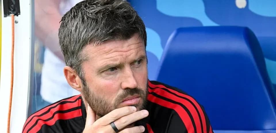 Coach sitting on bench during a match