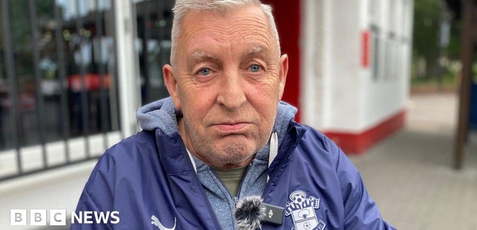 Man wearing Southampton FC jacket outdoors