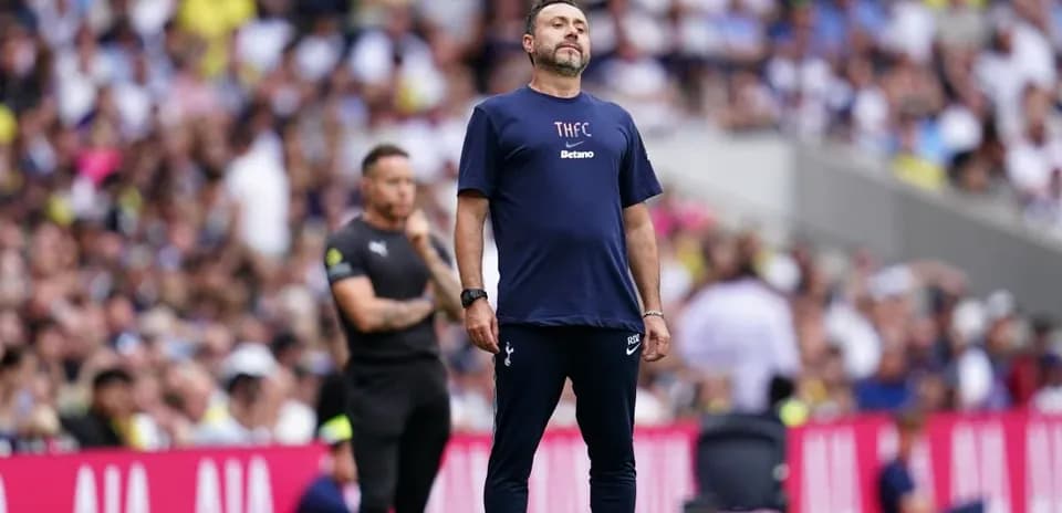 Coach observing match from the sidelines