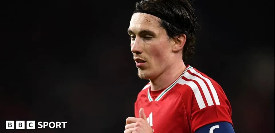 Player in red jersey with captain's armband