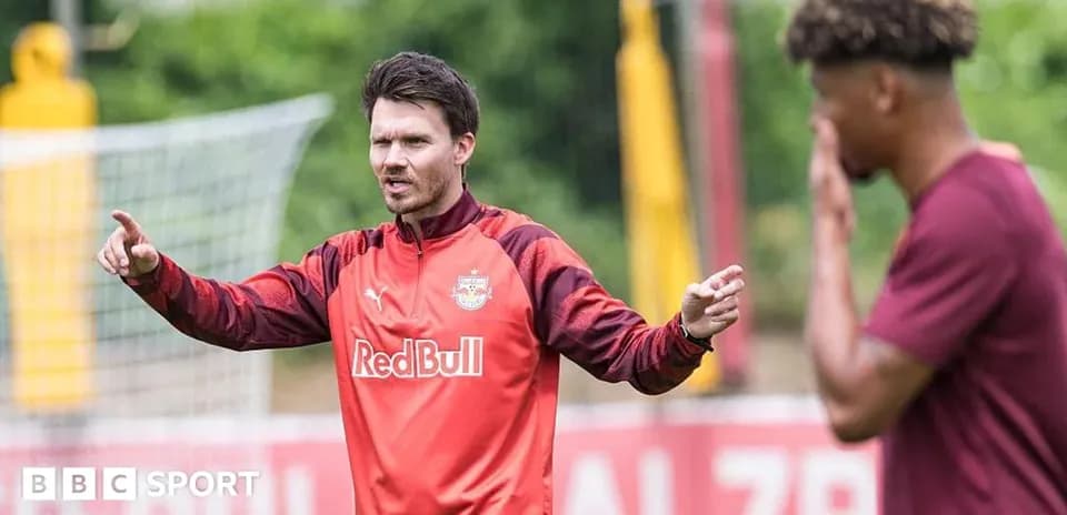 Coach instructing player during training session