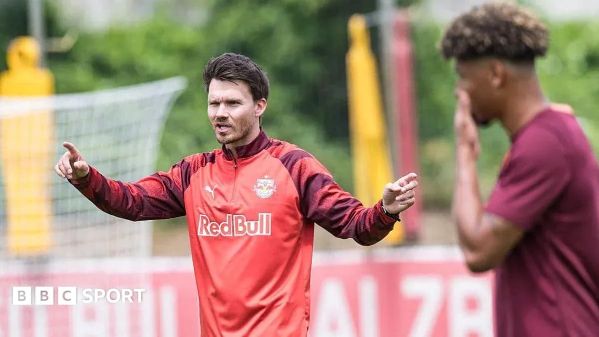 Coach instructing player during training session