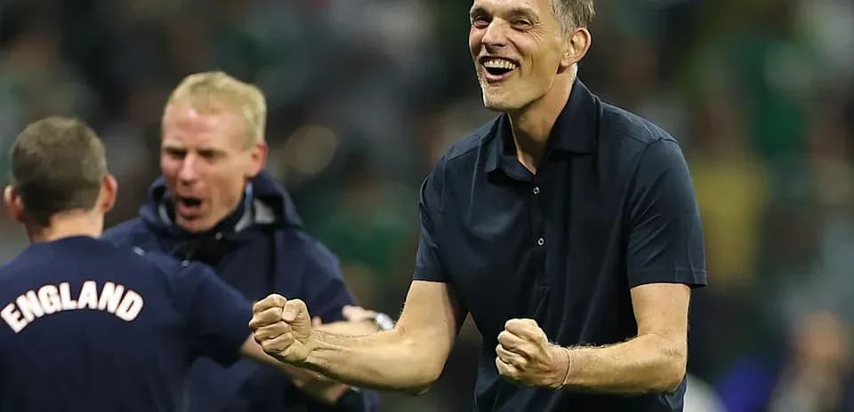 Coach celebrating victory with staff during match