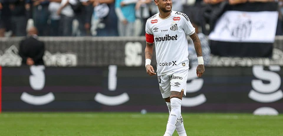 Neymar playing for Santos with fans in background