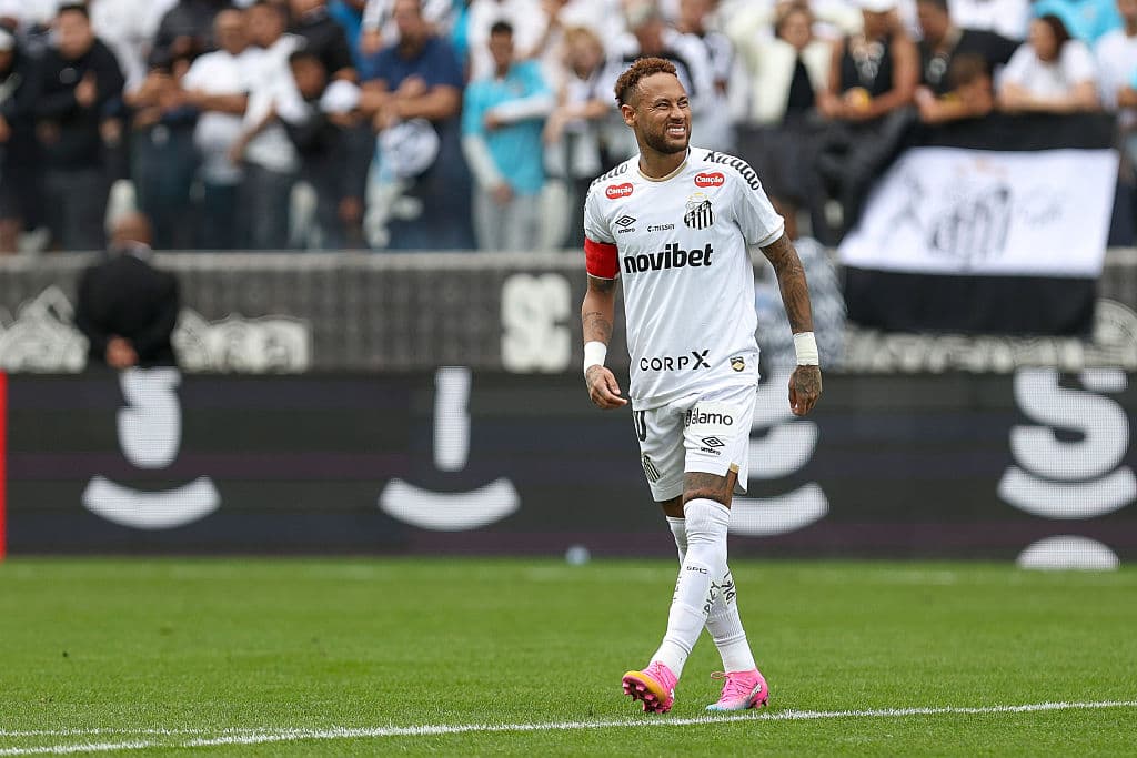 Neymar playing for Santos with fans in background