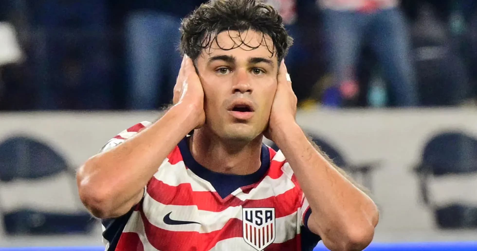 Player reacting during a match wearing USA jersey
