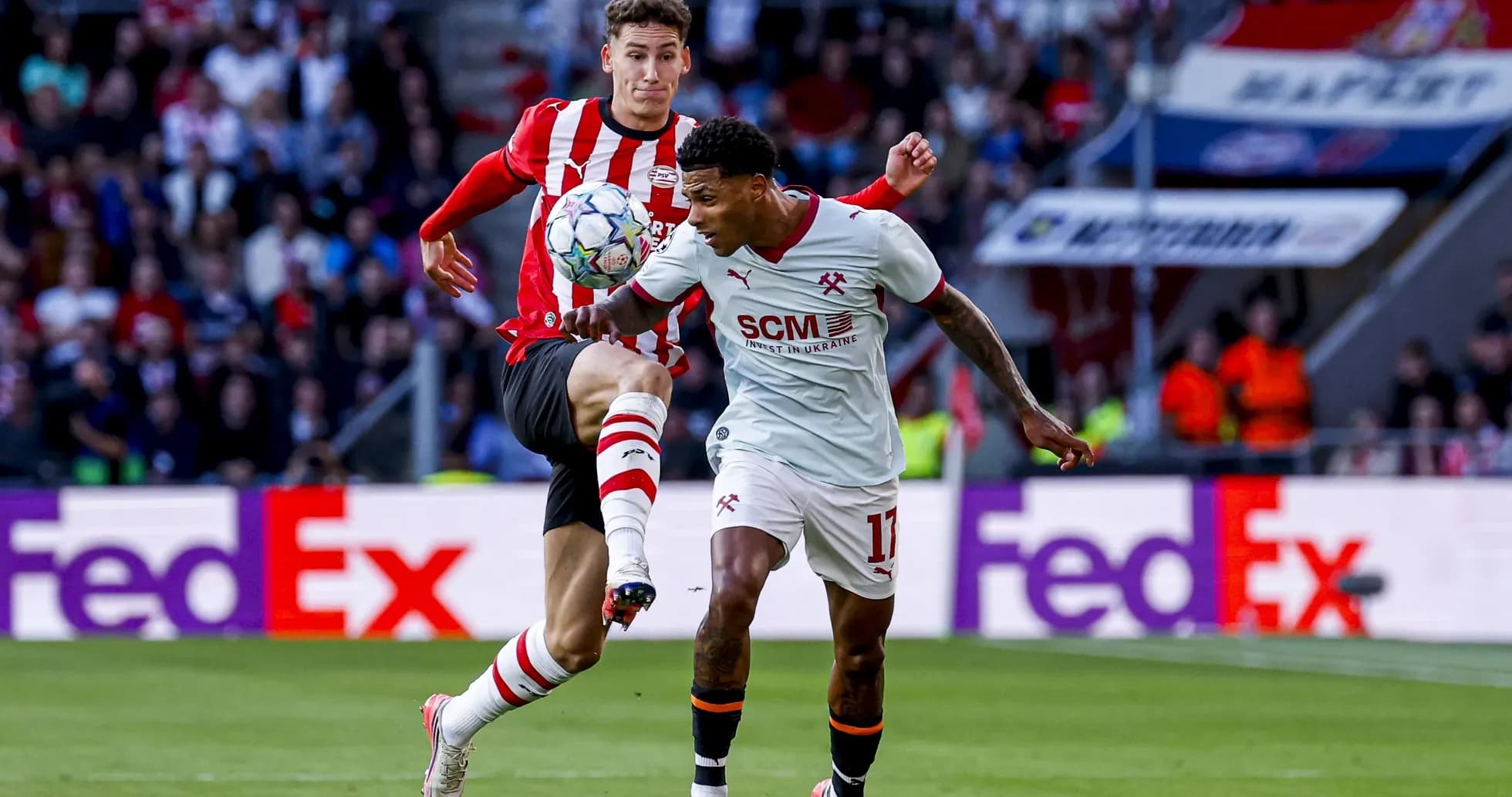 Two players battling for the ball during match