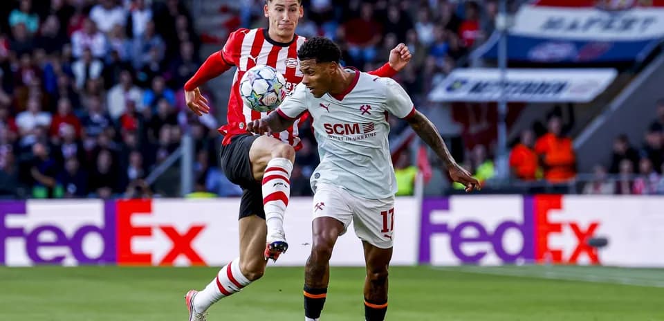 Two players battling for the ball during match