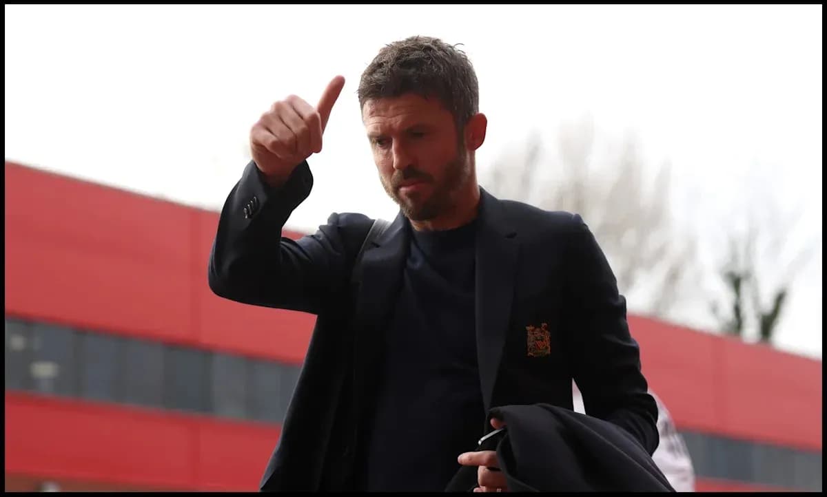 Manager giving a thumbs up outside stadium