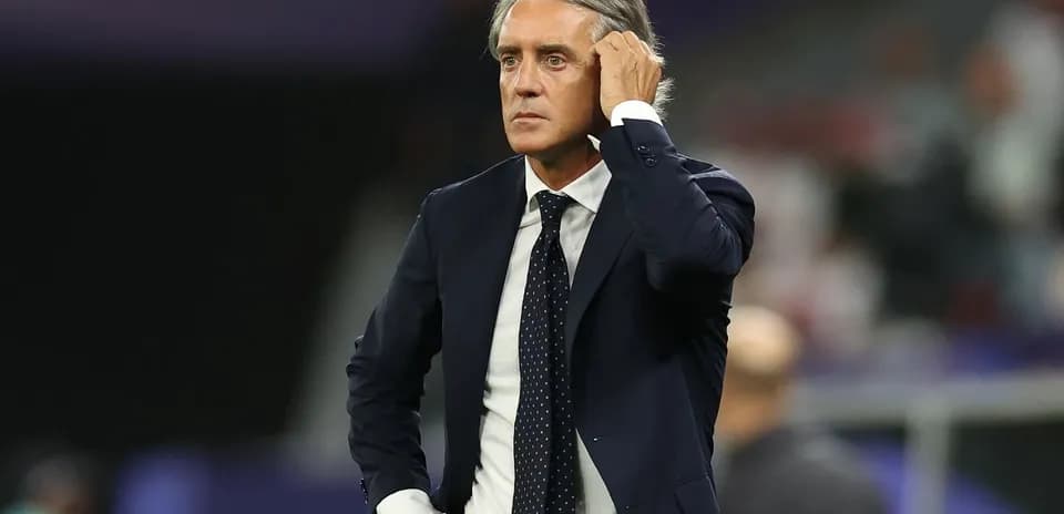 Manager looking thoughtful during a match