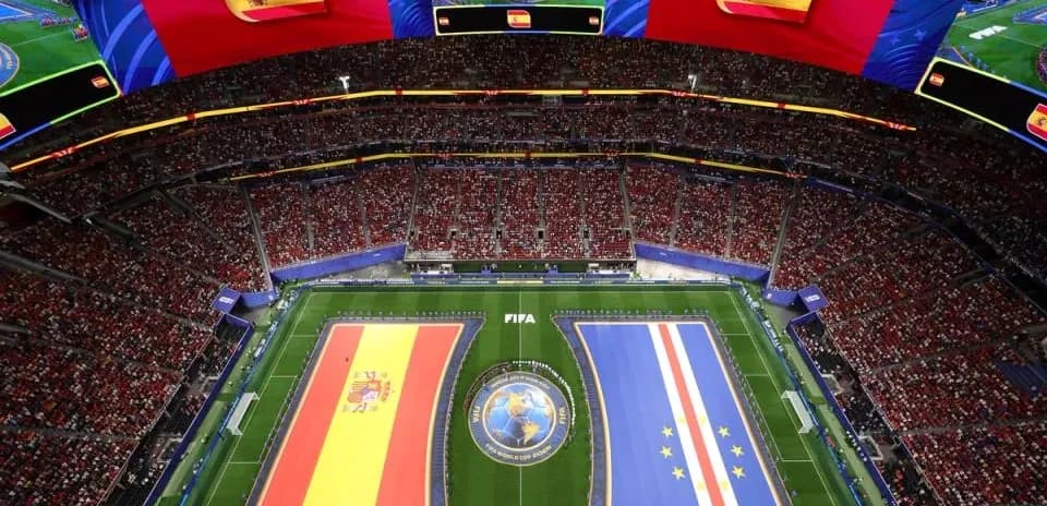Stadium filled with fans, Spain and Cape Verde flags displayed
