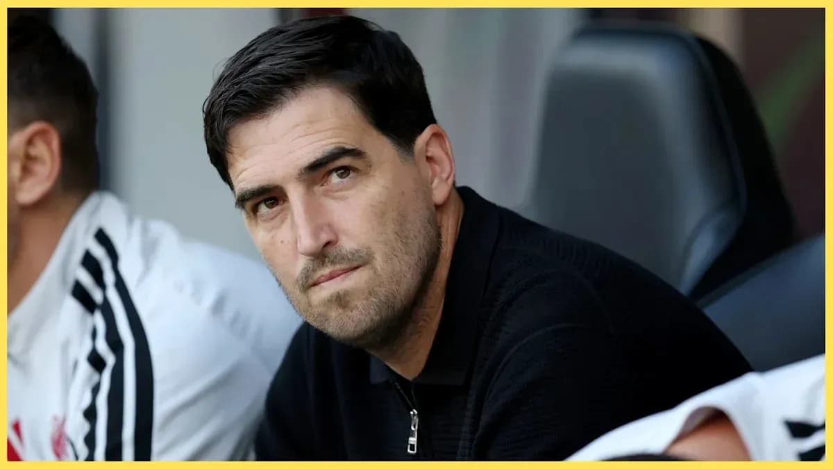 Coach observing from the bench during a match