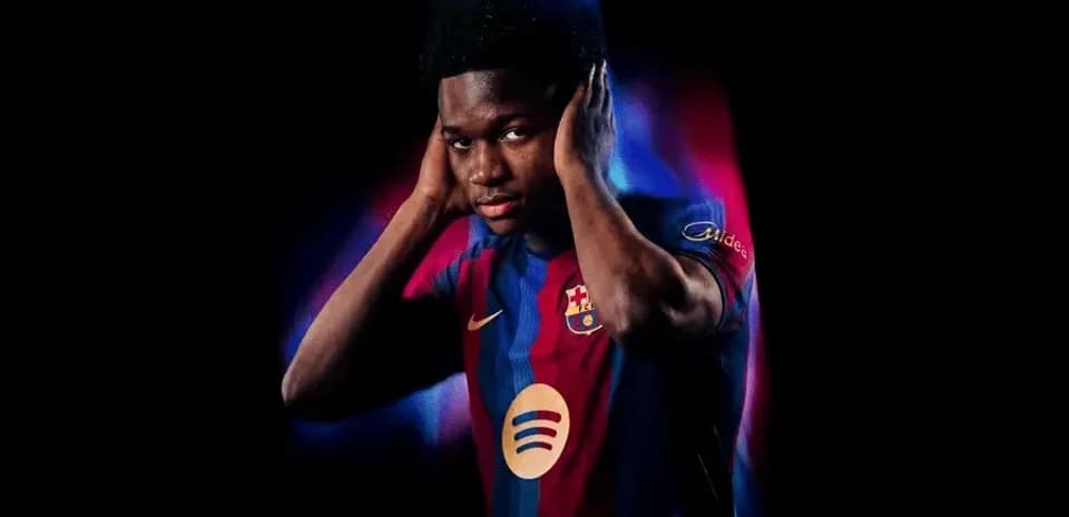 Player wearing Barcelona jersey with hands on ears