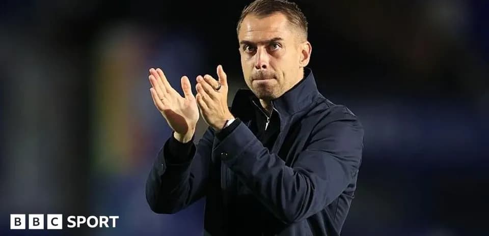 Coach applauding during a match or event