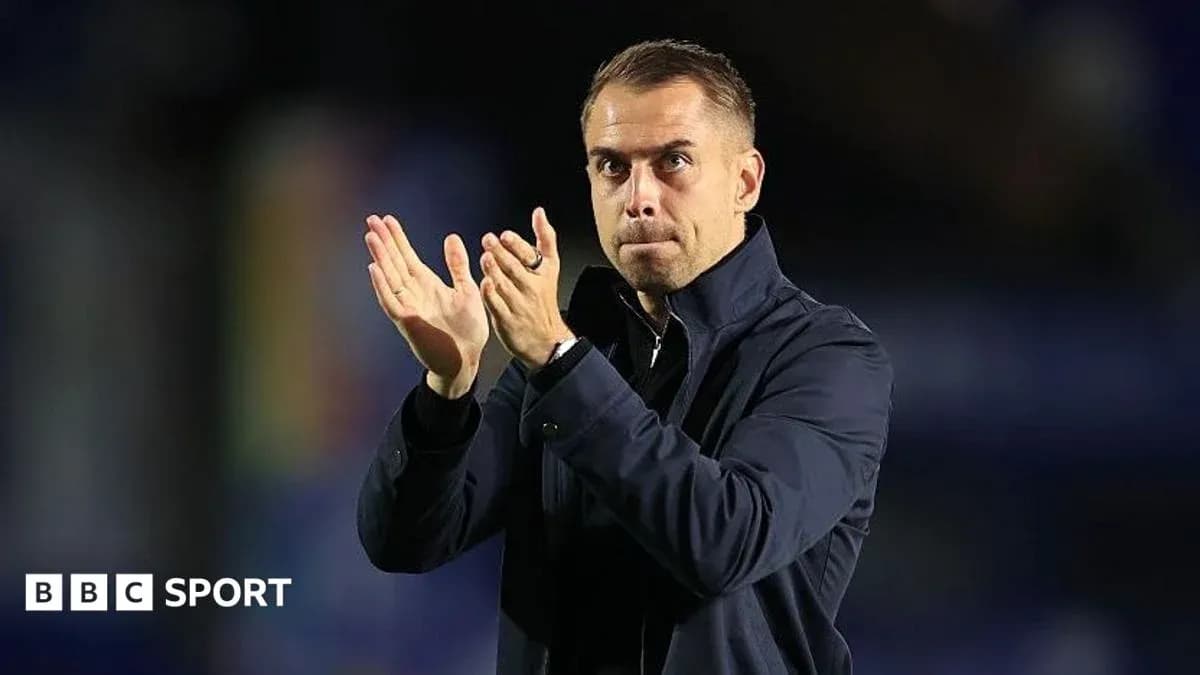 Coach applauding during a match or event
