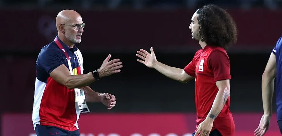 Coach and player greeting on the sidelines