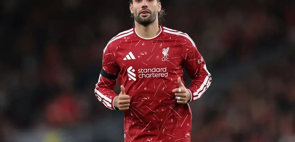 Player warming up in Liverpool FC training kit