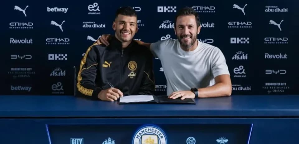 Player and manager signing contract at table