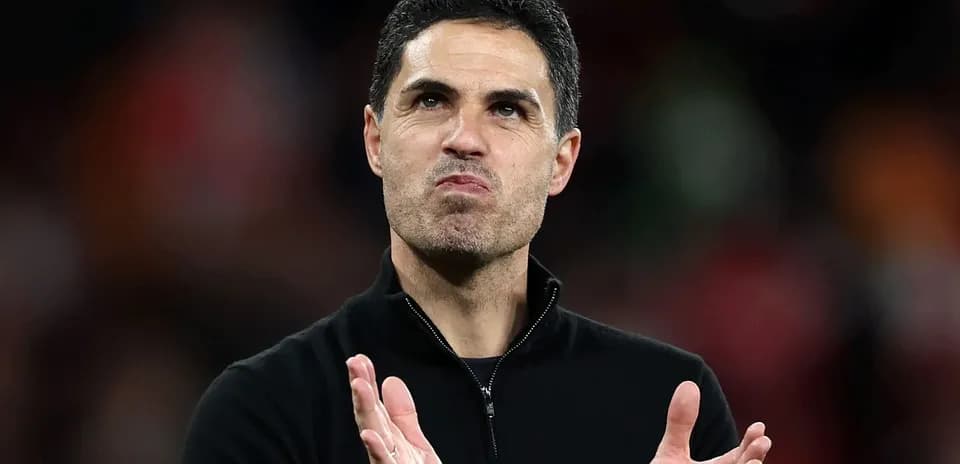 Coach applauding during a match at the stadium