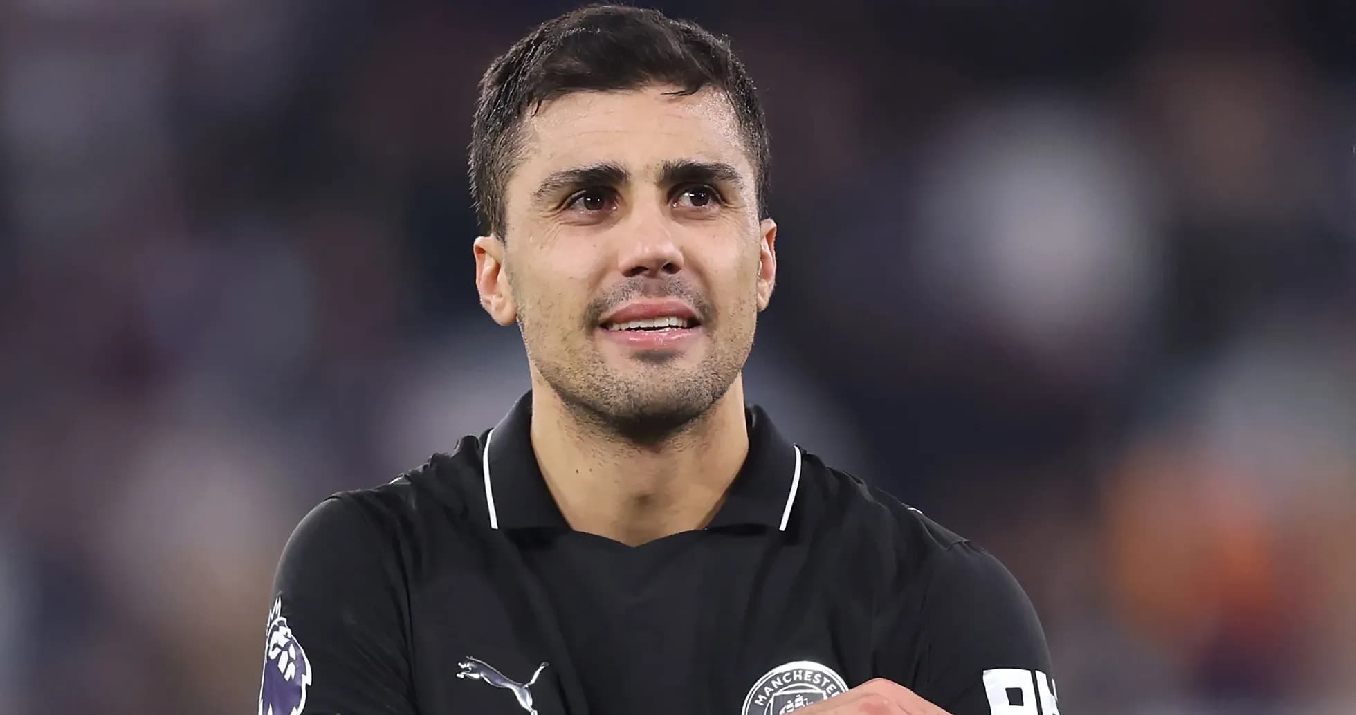 Player in black jersey looking at the crowd