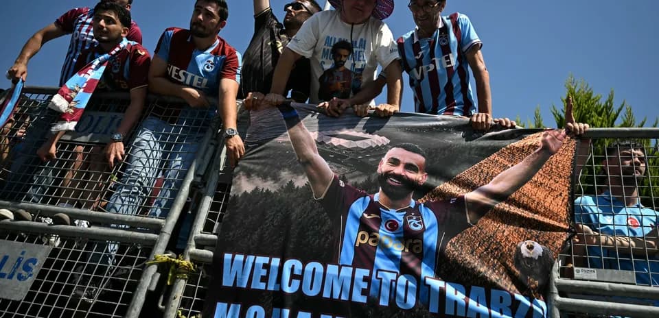 Fans holding a banner welcoming Mohammed Salah