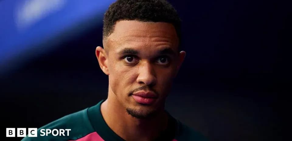 Player posing in team kit before match