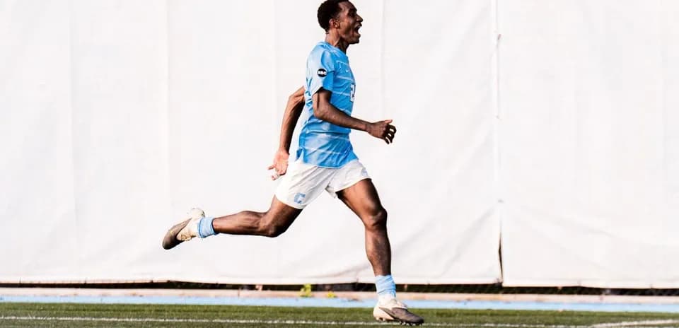 Player celebrating a goal on the field