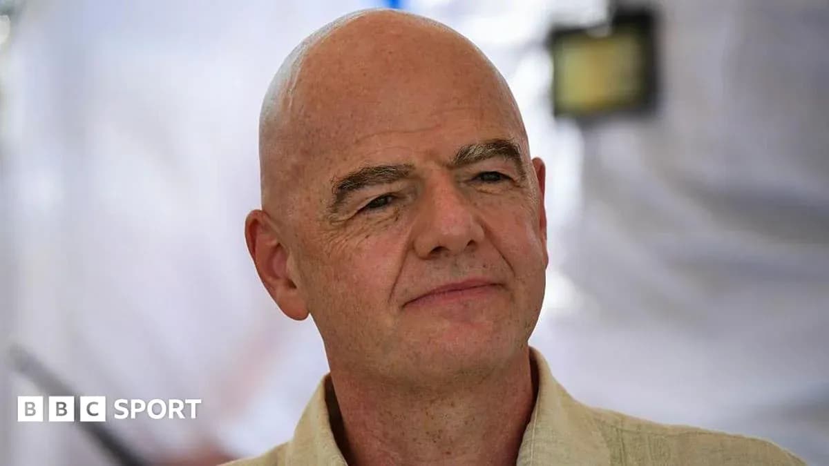 Man with bald head speaking at event