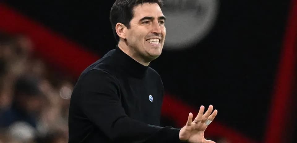 Coach gesturing during match on the sidelines