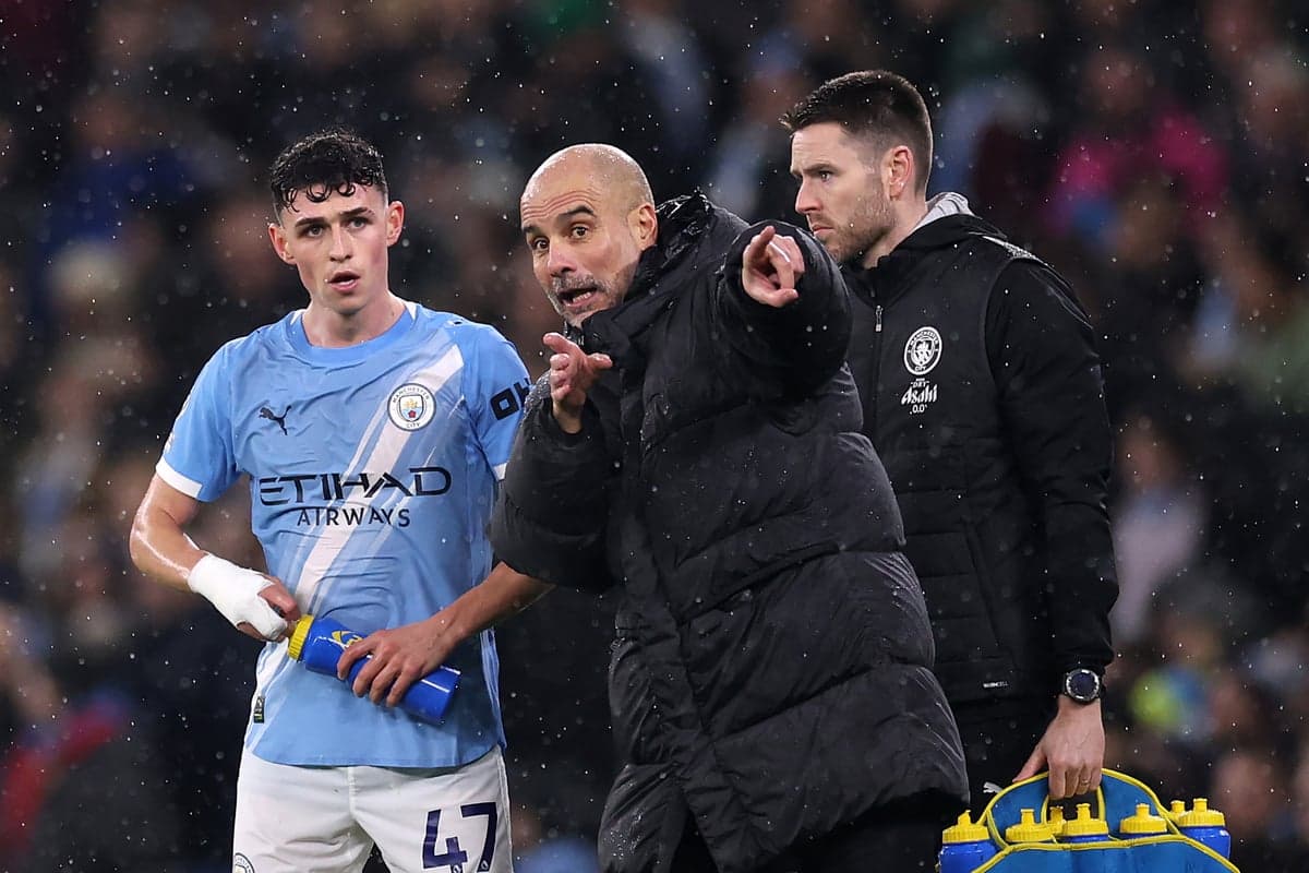 Pep Guardiola giving instructions to Phil Foden