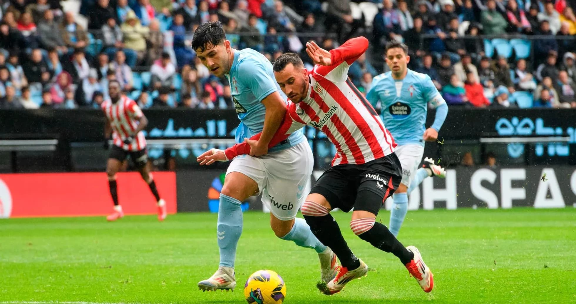 Athletic Club player challenges Celta Vigo opponent