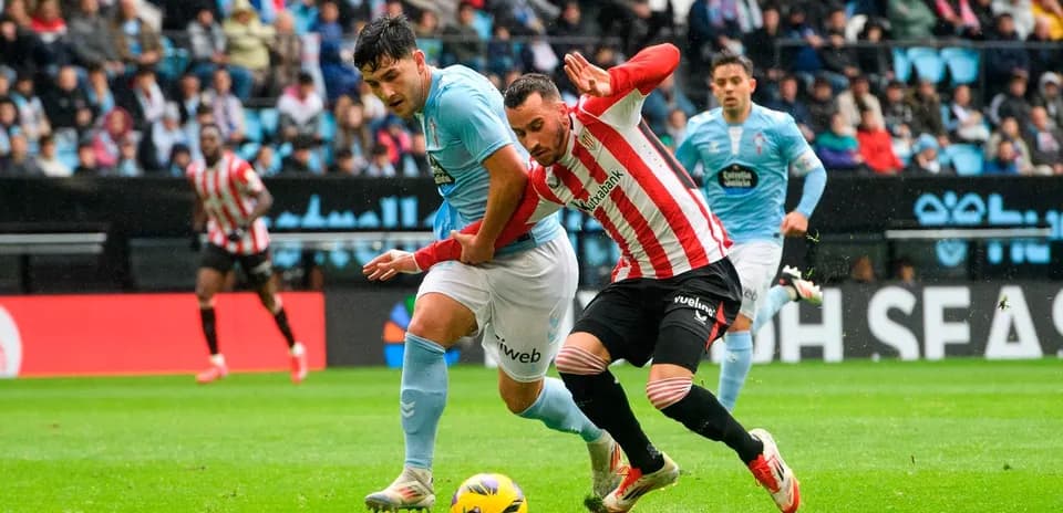 Athletic Club player challenges Celta Vigo opponent