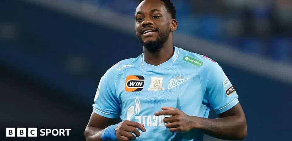 Player celebrating during a match in blue jersey