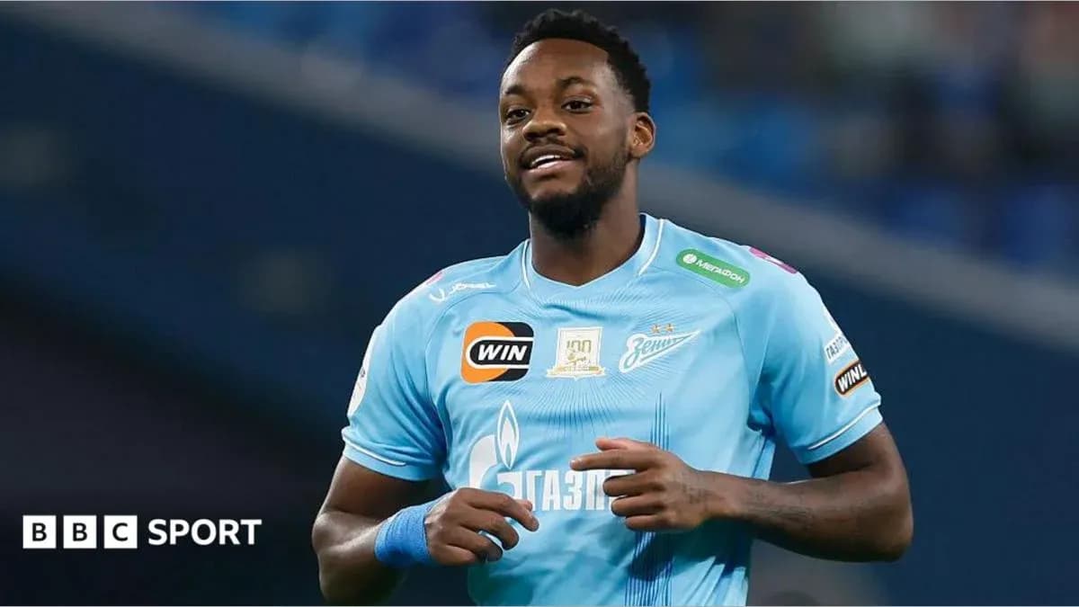 Player celebrating during a match in blue jersey
