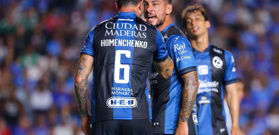 Players from Queretaro celebrating during match
