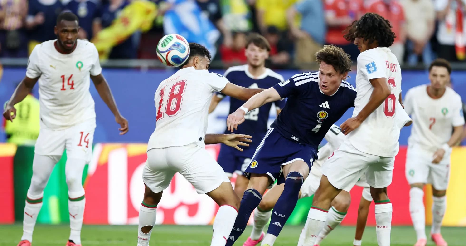 Players from Scotland and Morocco contesting the ball