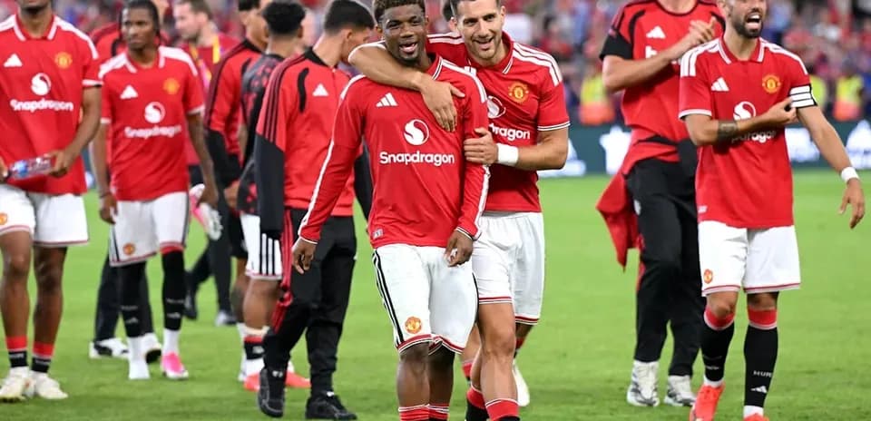 Manchester United players celebrating after match victory
