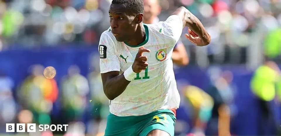 Senegal player sprinting during a football match
