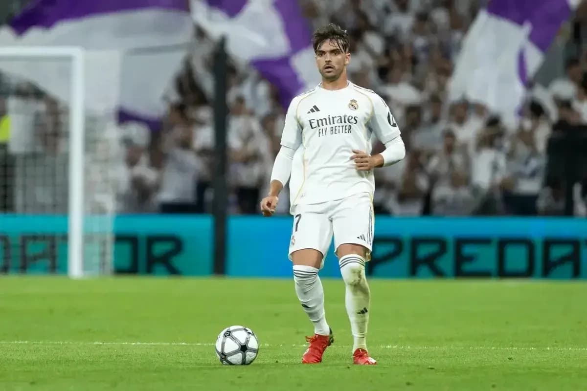 Player preparing to take a free kick on field